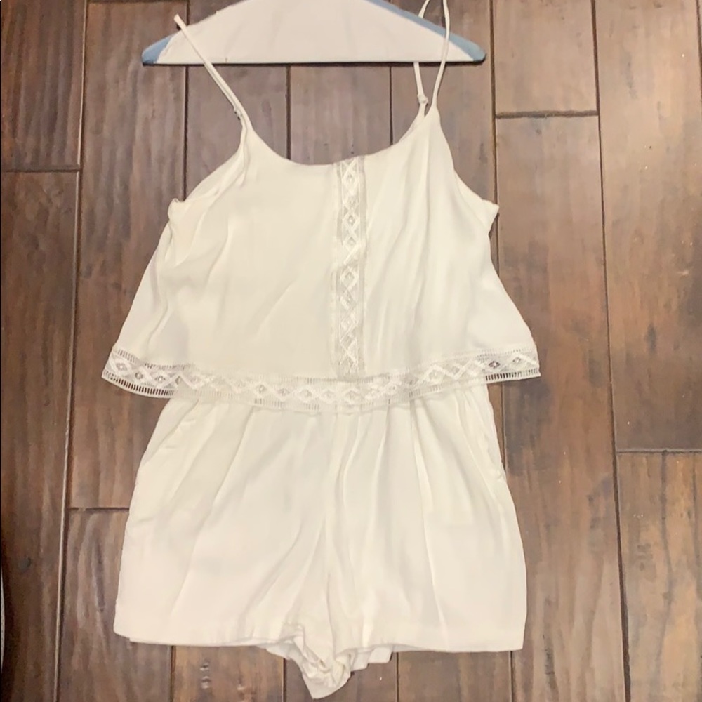Have white romper size medium